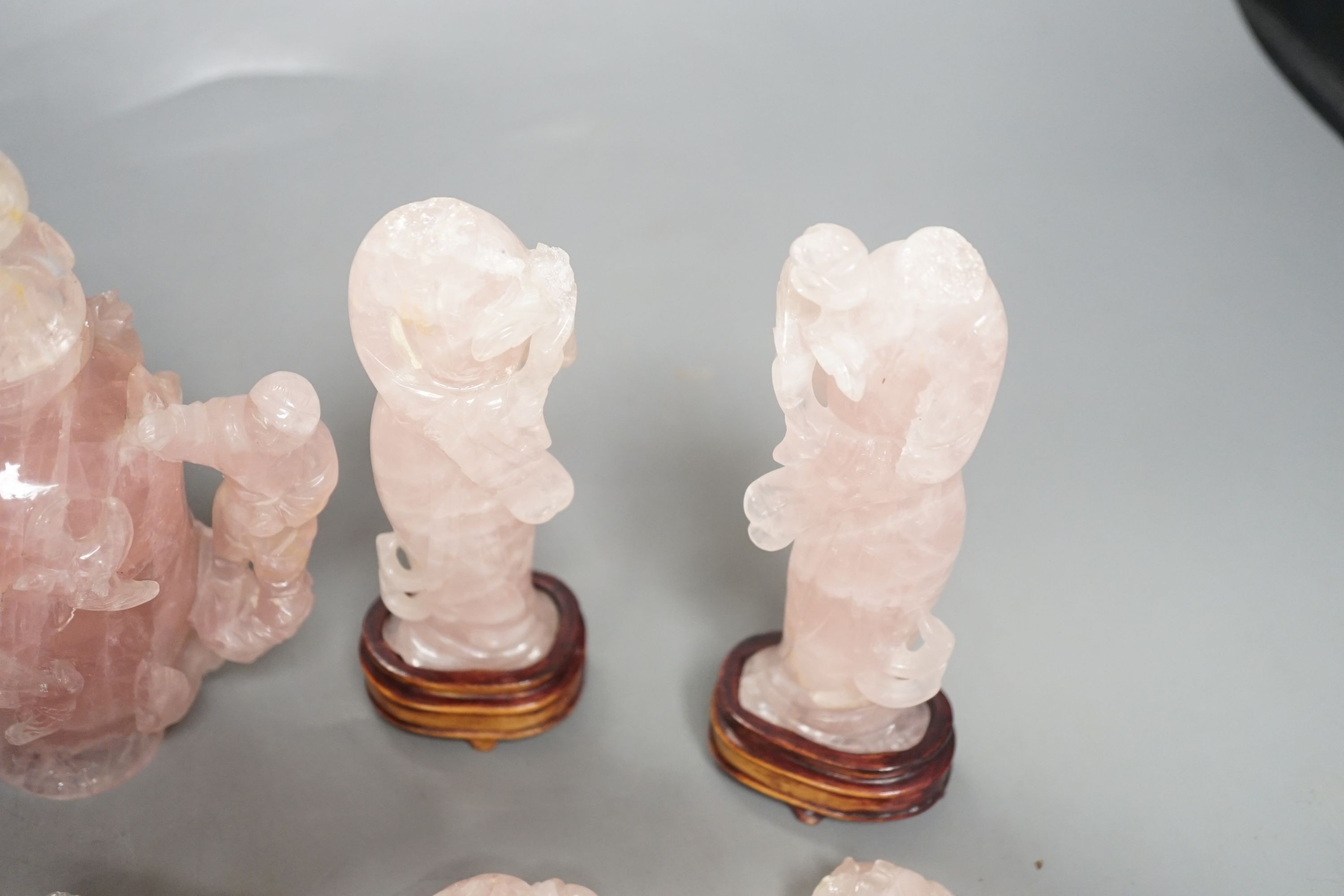 Various rose quartz figures and a cylindrical snuff bottle, hard stone cat and two glass pots, rose quartz vase and cover 17 cms high.